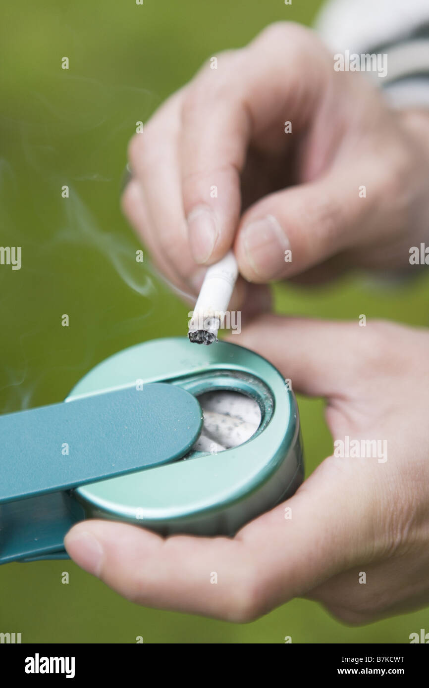 Portable Ashtray and Cigarette Stock Photo