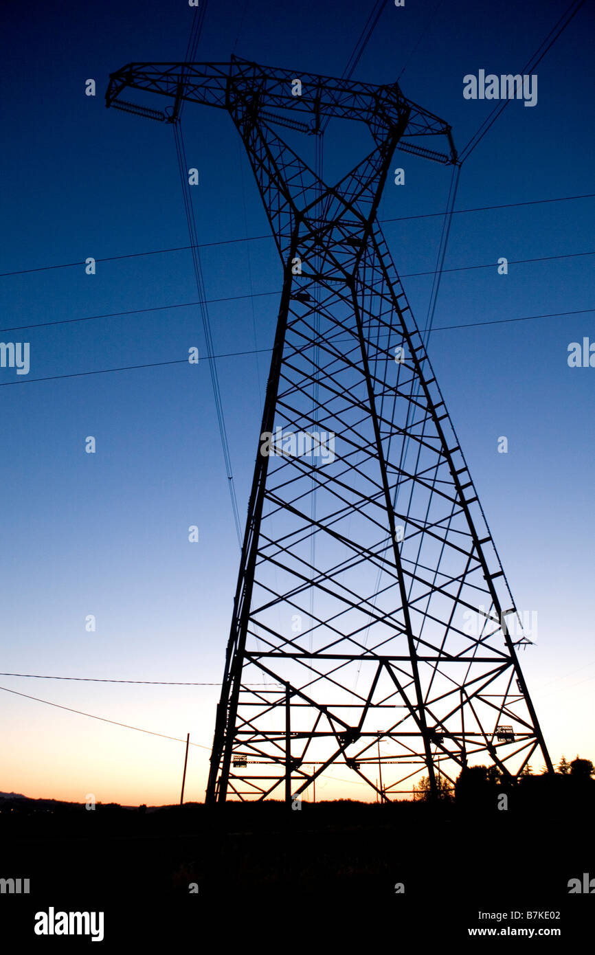electric pylon silhouette at evening Stock Photo