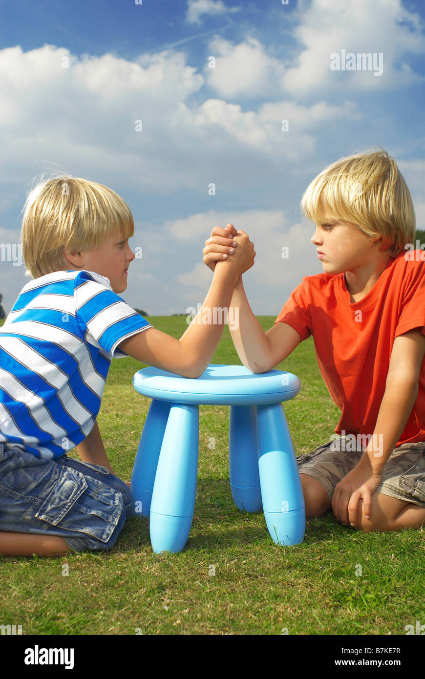 two boys arm wrestling Stock Photo Alamy