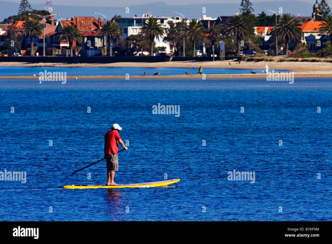 Melbourne Beaches / A man paddle boards near St.Kilda Beach,in Melbourne Victoria Australia