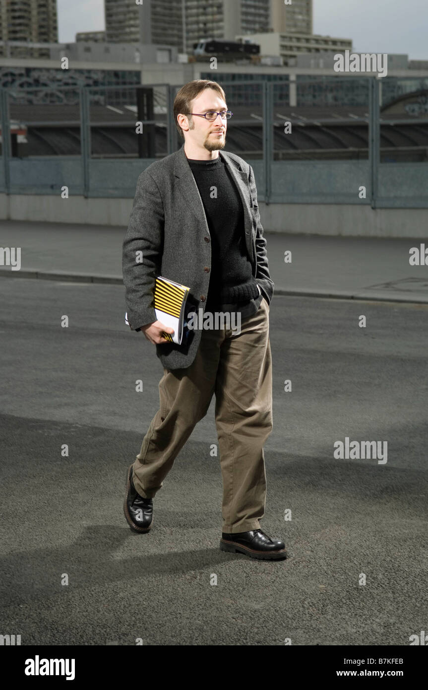 University student walking Stock Photo - Alamy