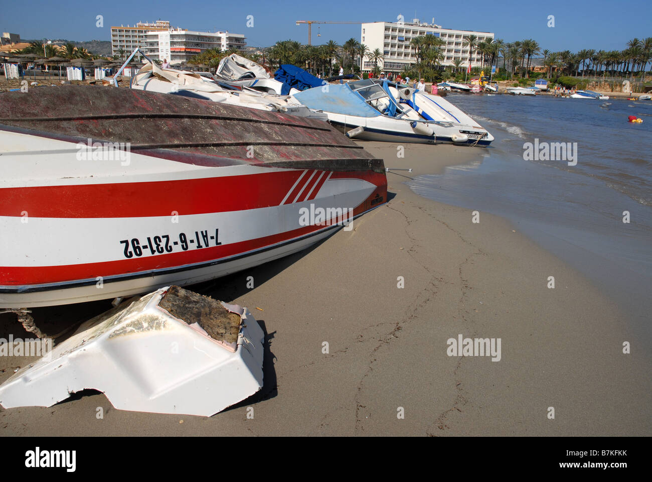 boats & debris washed up on Playa Arenal after storm, Oct 2007, Javea, Alicante Province,Valencia, Spain Stock Photo