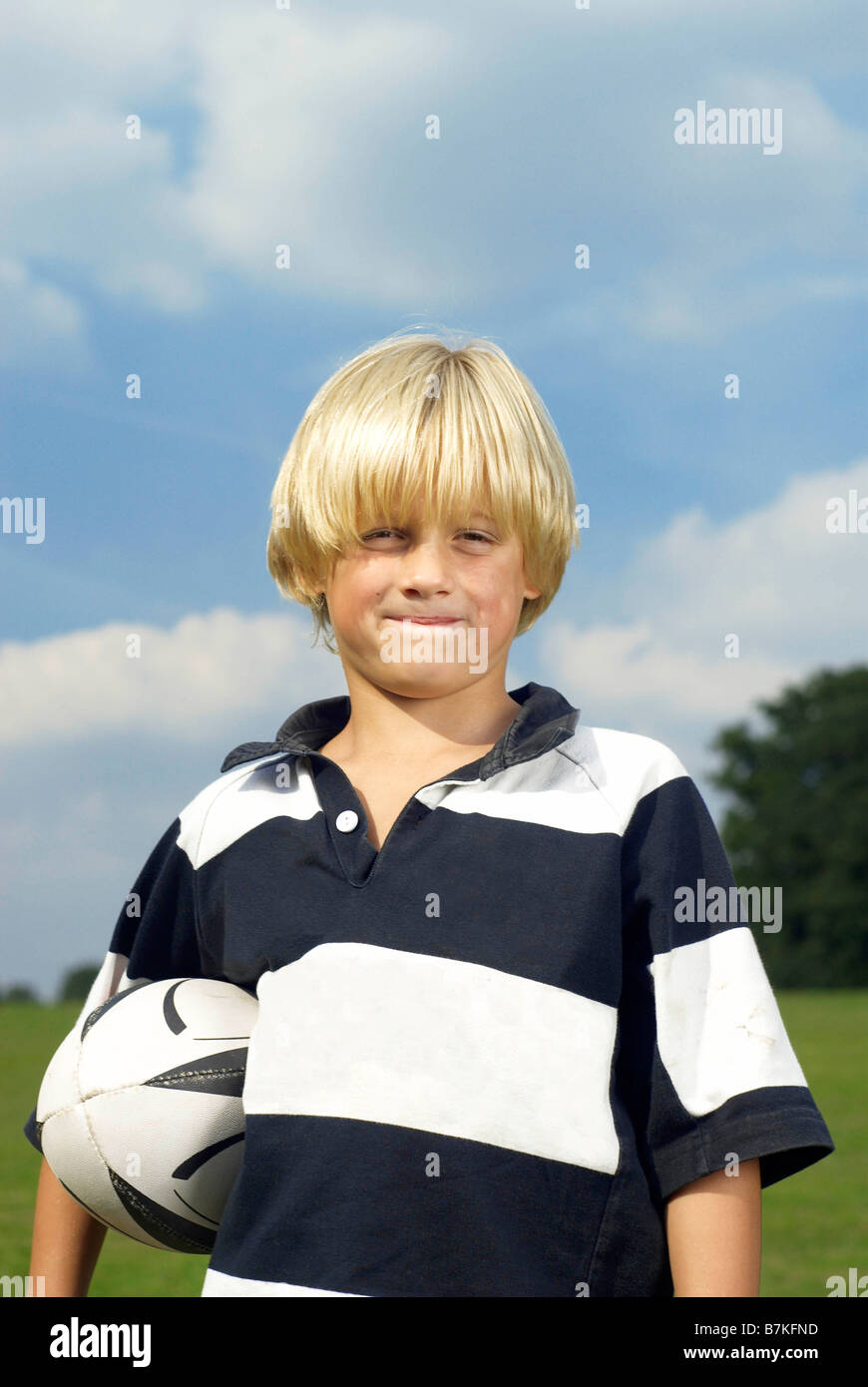 boy holding rugby ball Stock Photo Alamy