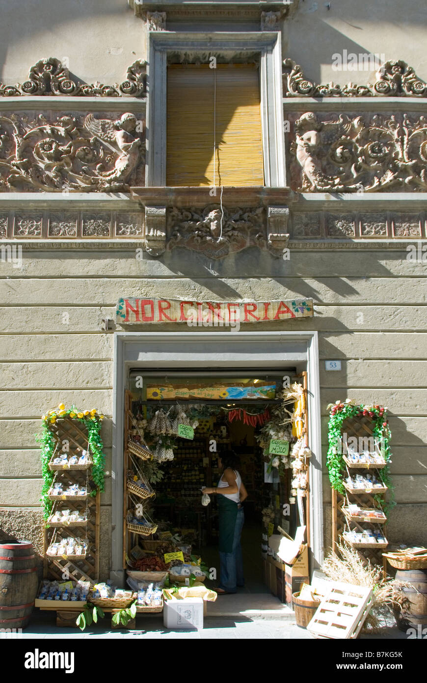 Umbrian produce store in a lavishly decorated building with terracotta embellishments of angels and cupids Stock Photo