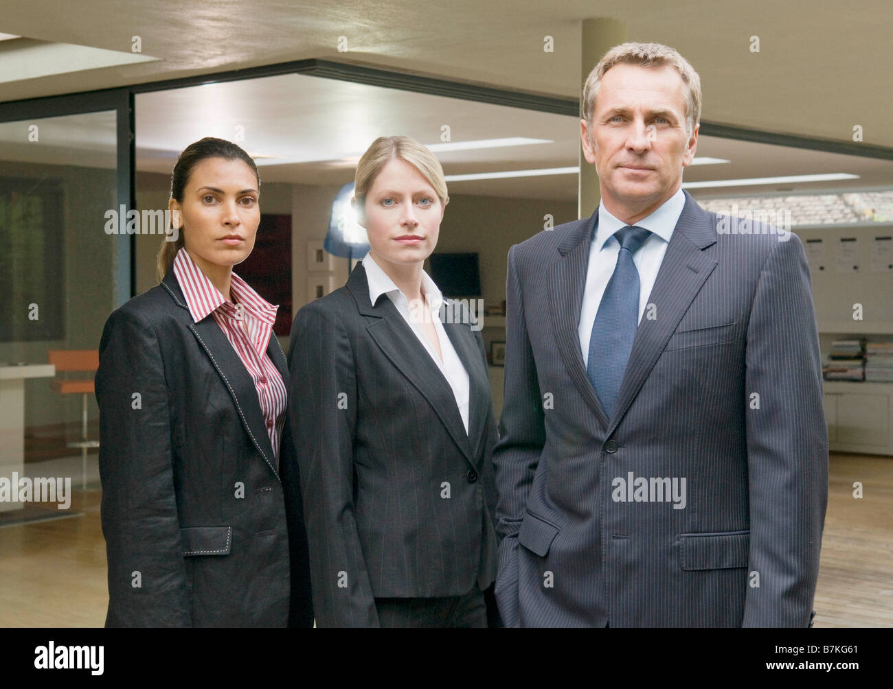A portrait of three business people Stock Photo - Alamy