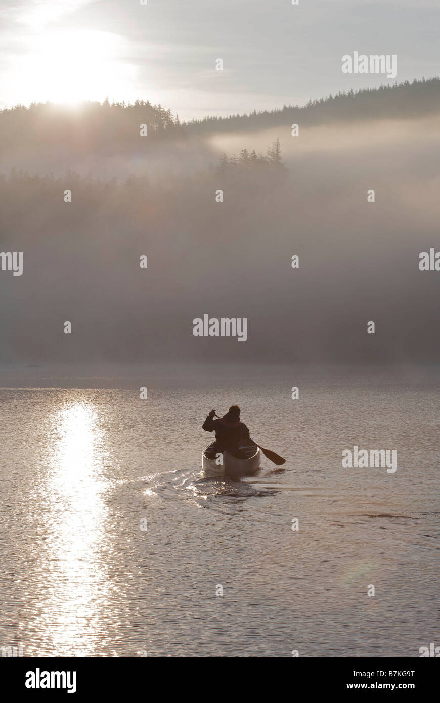 Kayaking in the morning mist. Stock Photo