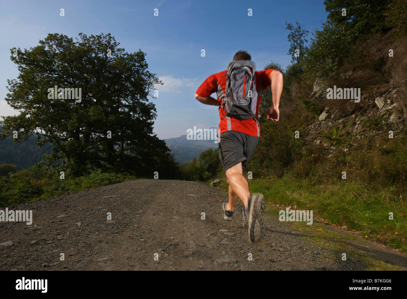 Male running in the hills Stock Photo Alamy