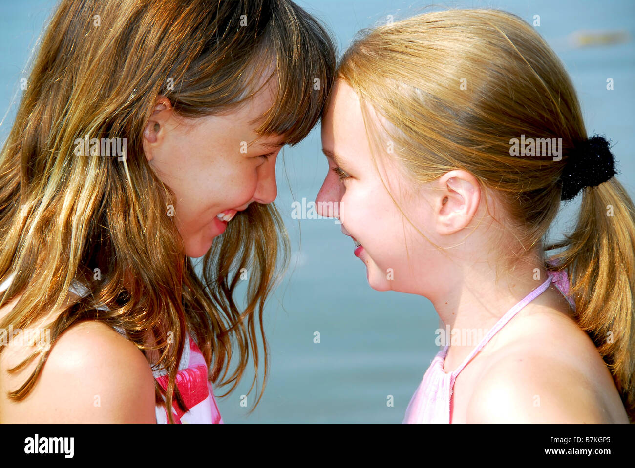 Portrait of two young happy girls Stock Photo - Alamy