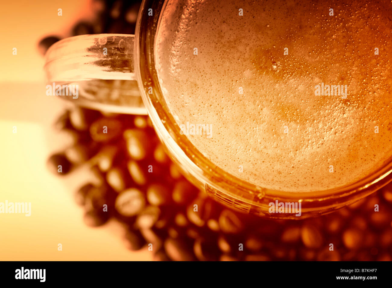 Cup with coffee, costing on coffee grain Stock Photo