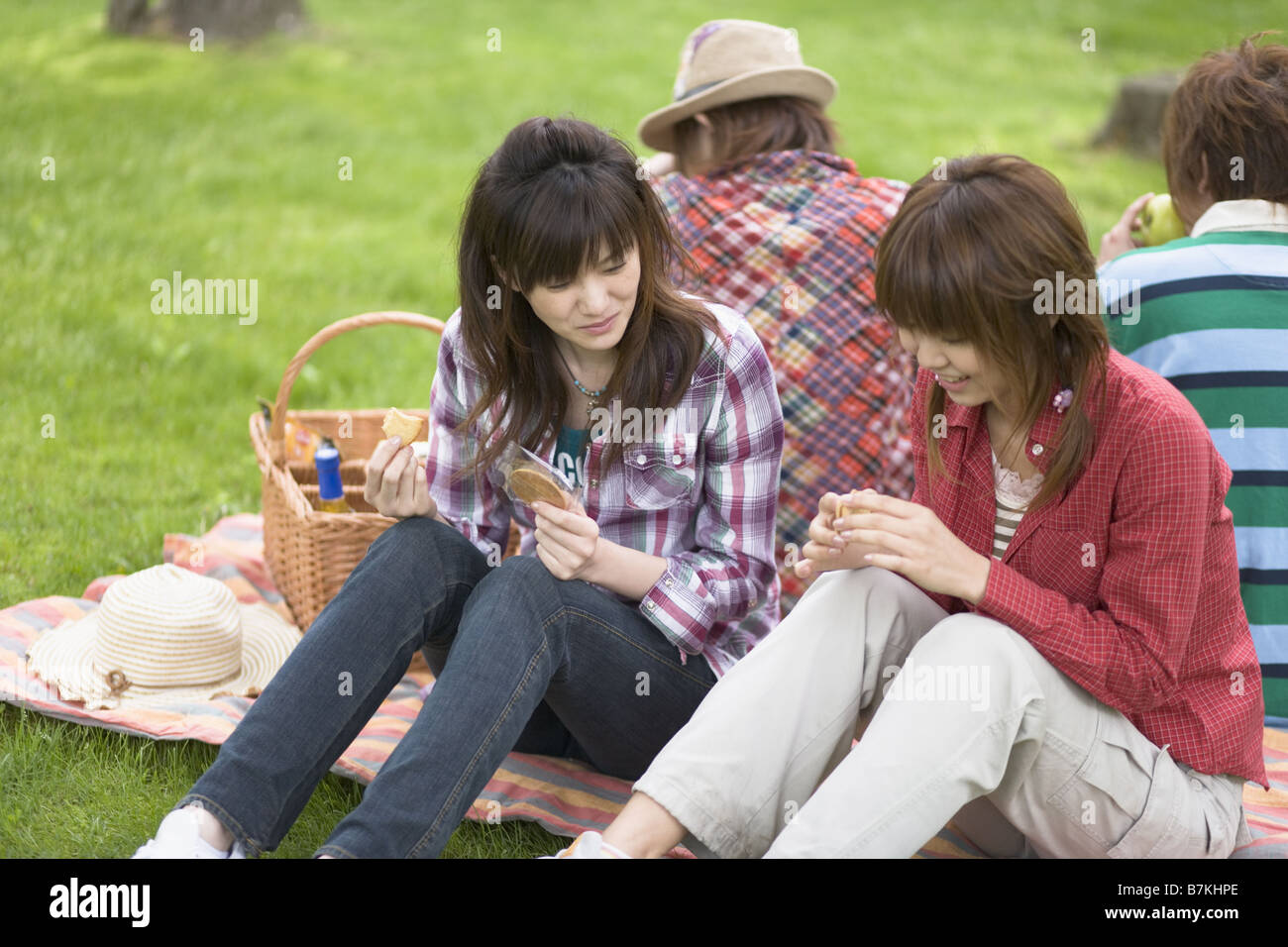 Men and Women Having a Picnic Stock Photo - Alamy