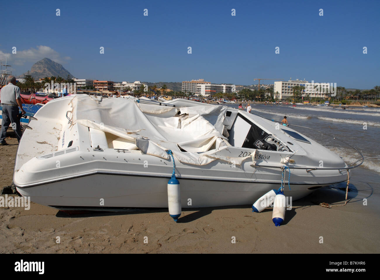 boats & debris washed up on Playa Arenal after storm, Oct 2007, Javea, Alicante Province, Comunidad Valenciana, Spain Stock Photo