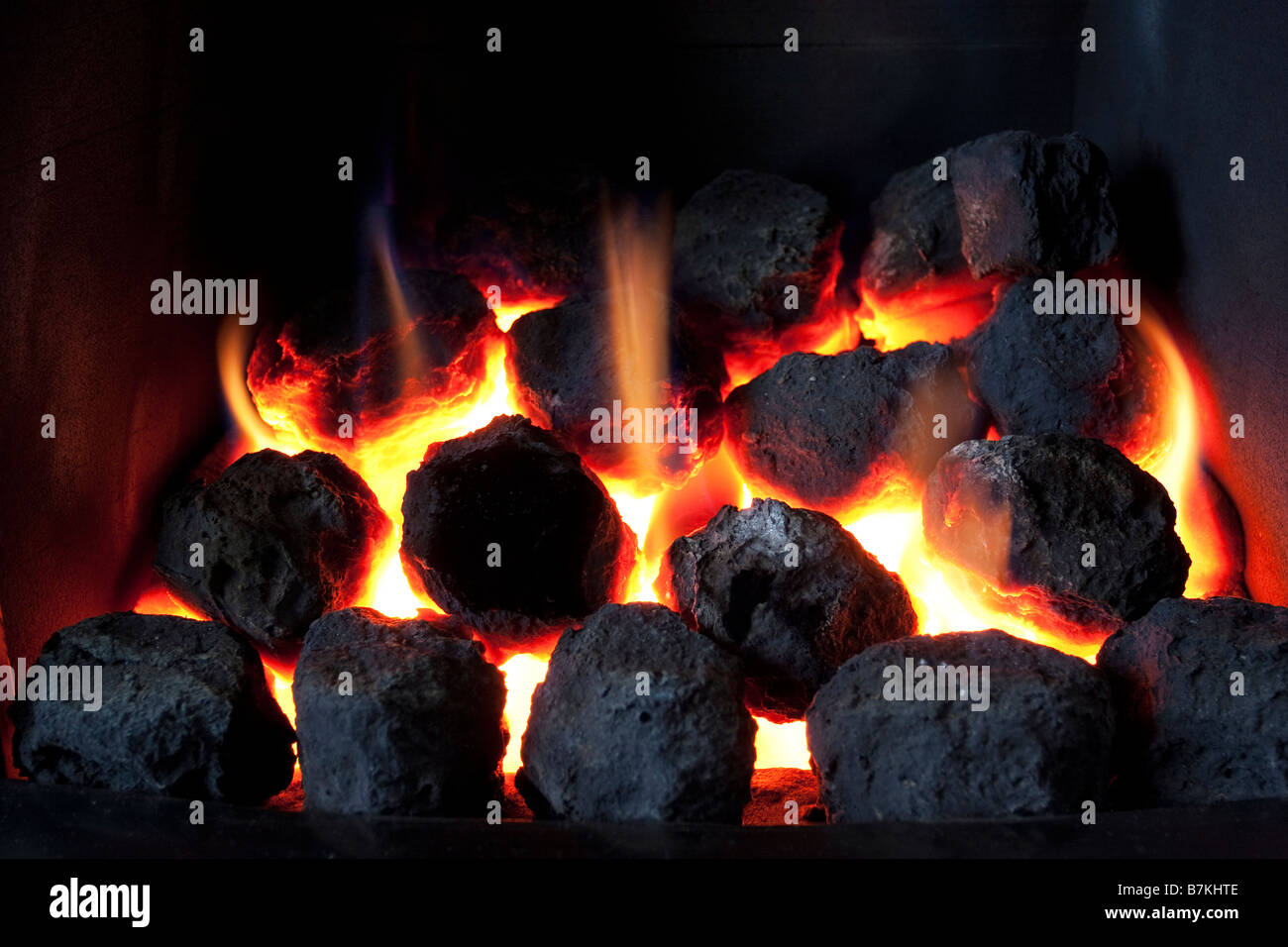 gas fire burning with artificial coals Stock Photo Alamy