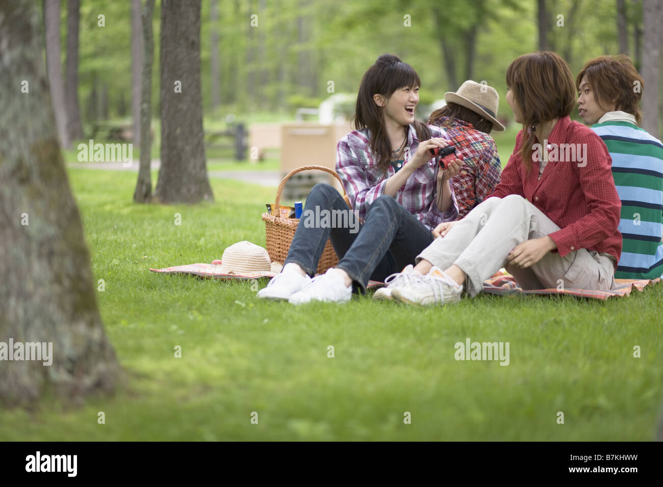Men and Women Having a Picnic Stock Photo - Alamy