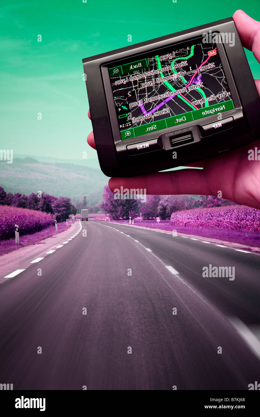 GPS Vehicle navigation system in a man hand Stock Photo Alamy
