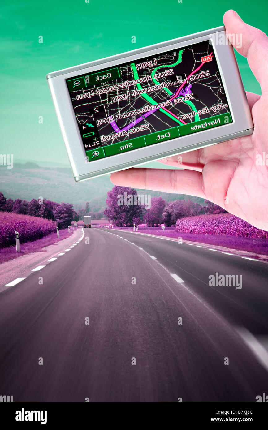 GPS Vehicle navigation system in a man hand Stock Photo