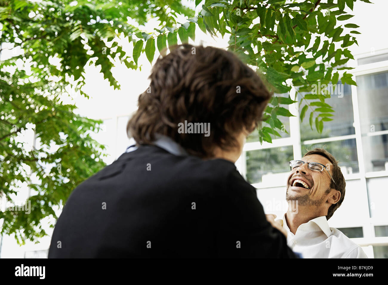 Men having a laugh, outside Stock Photo