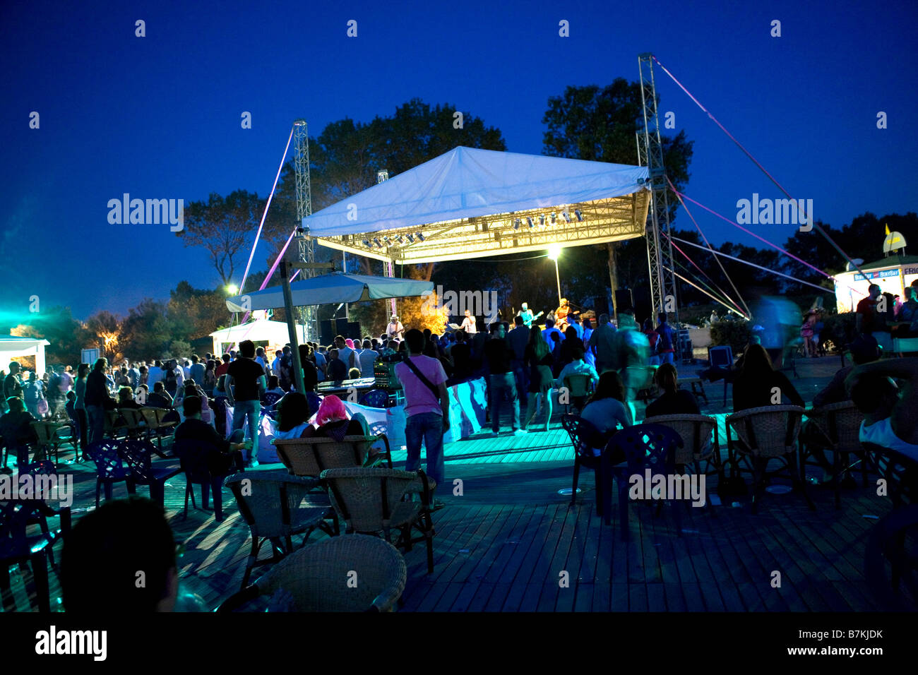 group of people listening to concert outdoor in summertime Stock Photo