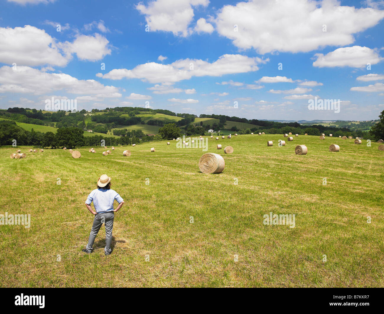 Man standing in field Stock Photo