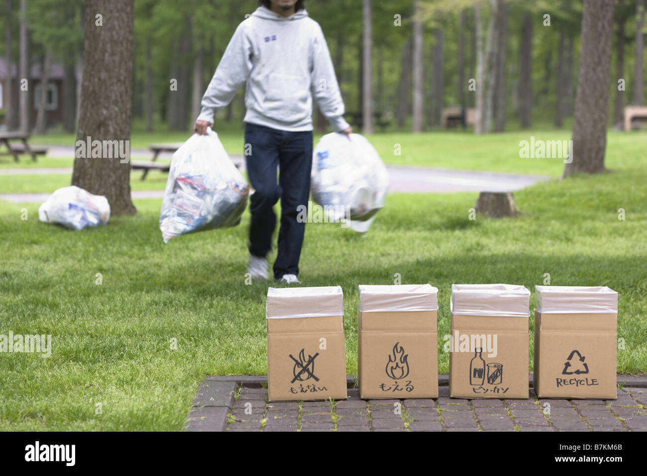Man with Bin Bag Walking Stock Photo Alamy