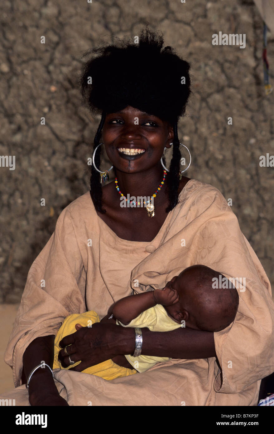 Gouré, Niger. Fulani Woman and Child. Note the facial tattoos around the mouth and chin. Stock Photo