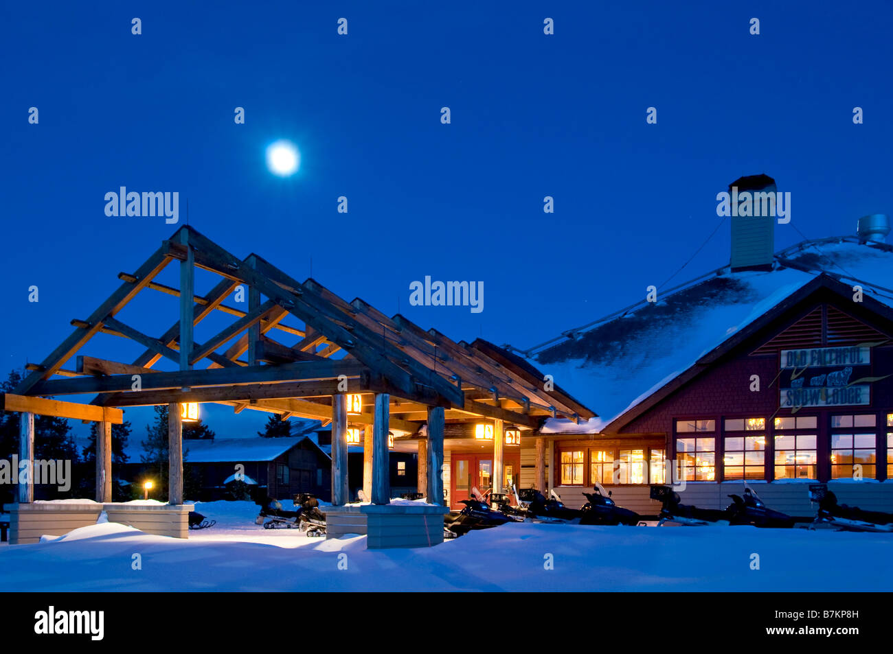 Xanterra Old Faithful Snow Lodge at dusk with full moon, winter