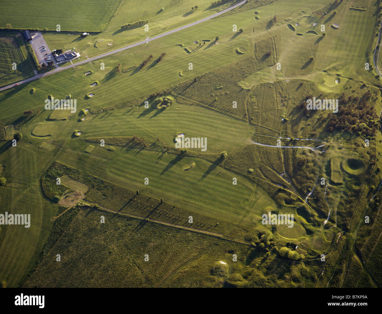 Calstone Down Wiltshire with golf course and prehistoric earthwork Aerial view from a hot air balloon. Stock Photo