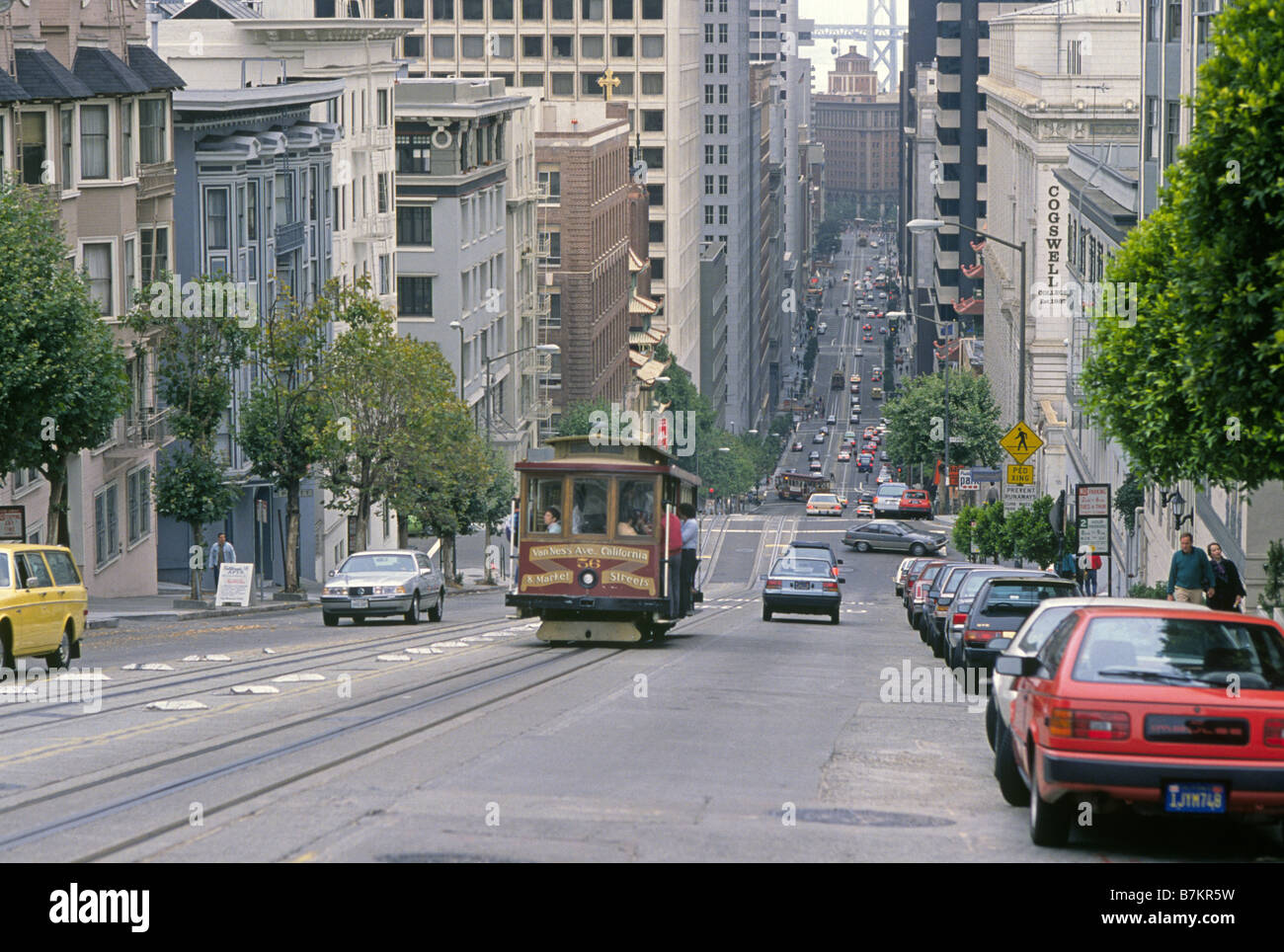A trolley car negotiates a steep hill on Van Ness Avenue in the city of San Francisco Stock Photo