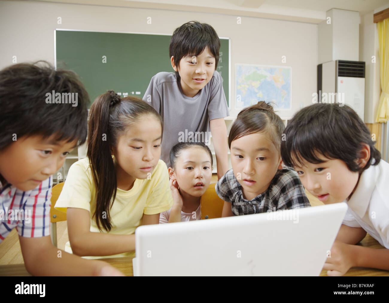Elementary school students using laptop Stock Photo Alamy