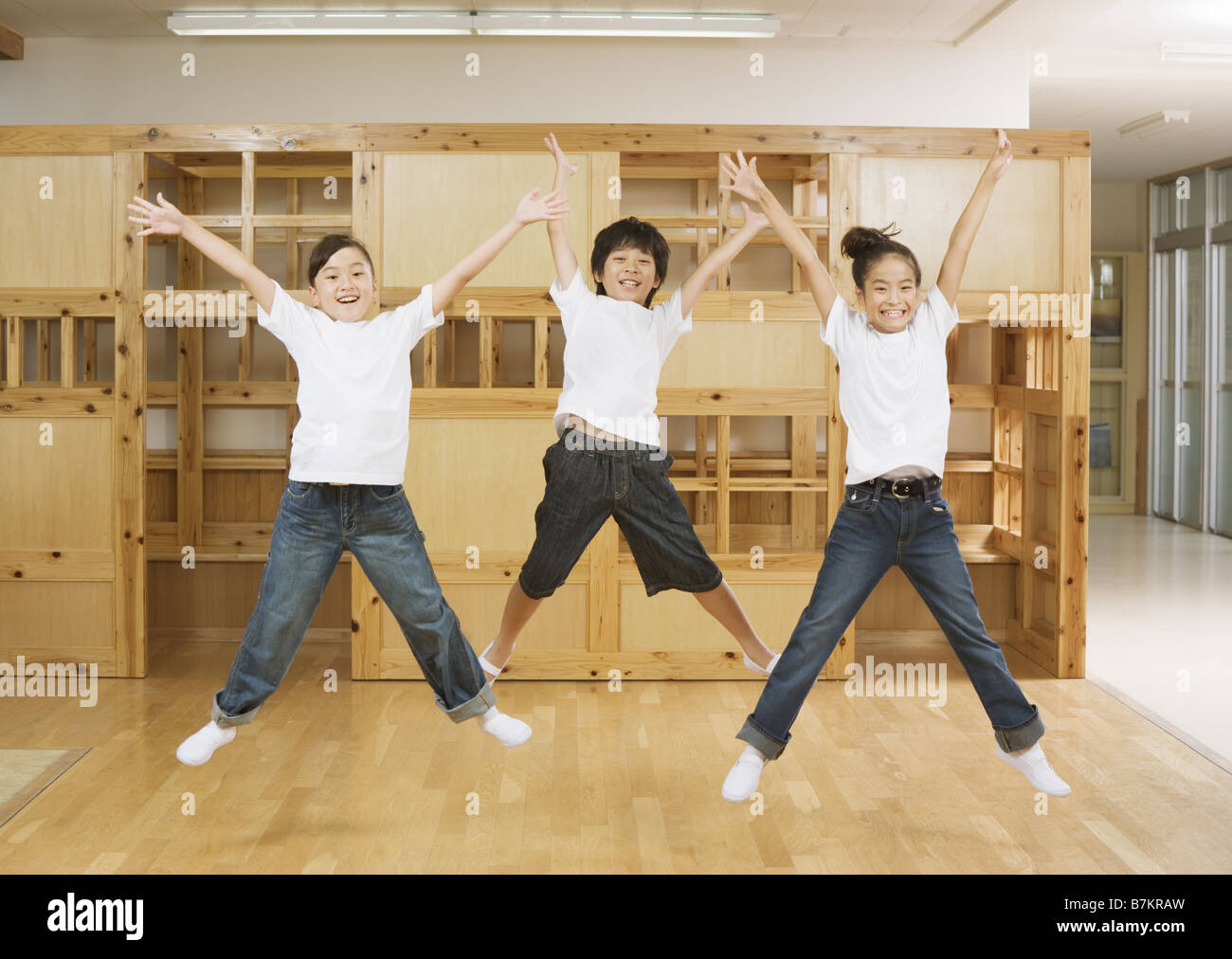 Elementary school students jumping Stock Photo Alamy
