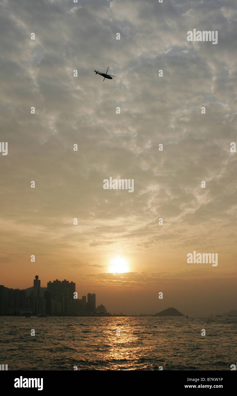 Hong Kong harbour at sunset Stock Photo - Alamy