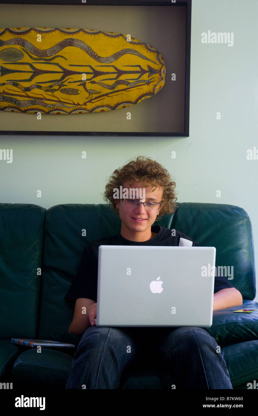 Young boy using an Apple laptop computer Stock Photo - Alamy