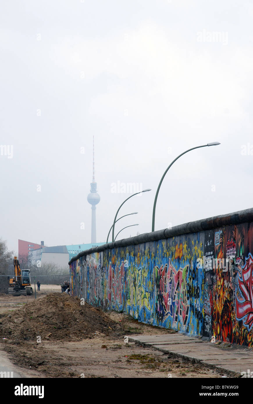 Section of the Berlin Wall with the TV Tower in the background Stock Photo
