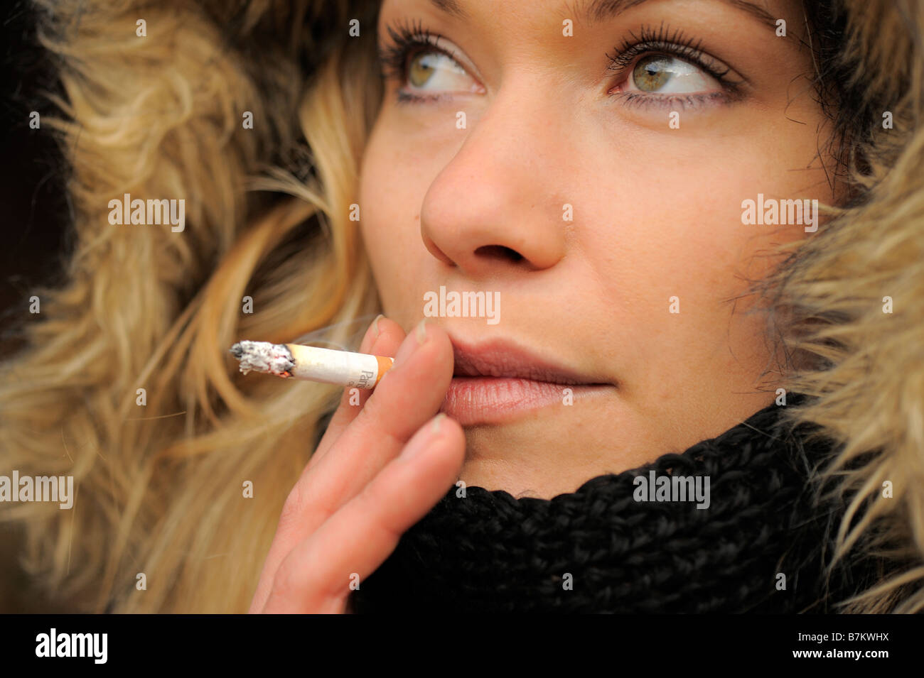 young woman smoking Stock Photo