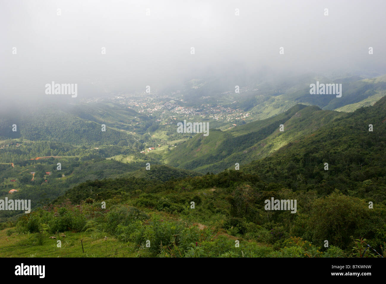 View of town of Novo Friburgo in valley covered in cloud Rio de Janeiro state Brazil Stock Photo