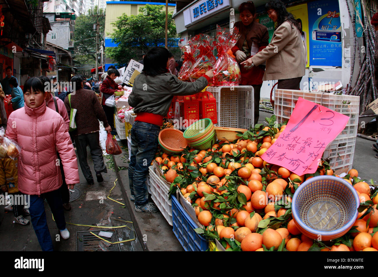 active bustle bustling busy streets health China Chinese community consumers driven emergent markets emerging Growth passers by Stock Photo