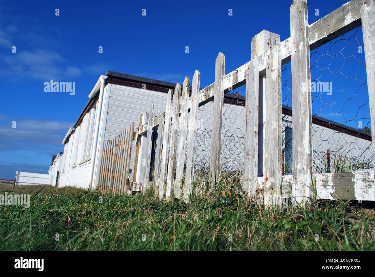 White picket fence around a beach house Stock Photo Alamy