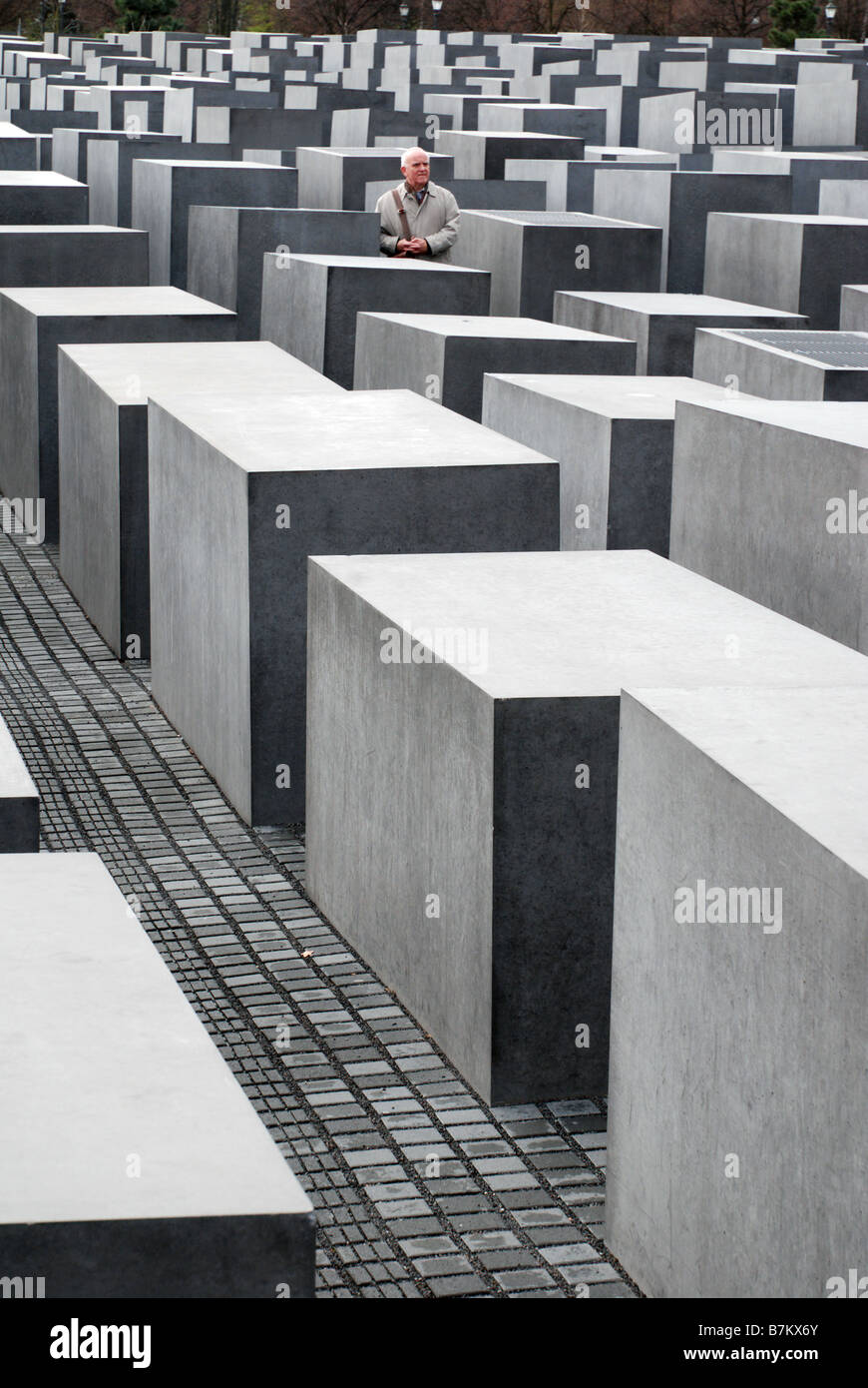 Man visiting the Holocaust Memorial in Berlin Stock Photo