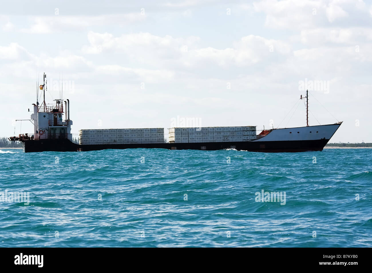 island trading cargo carrier ship near coast Stock Photo Alamy