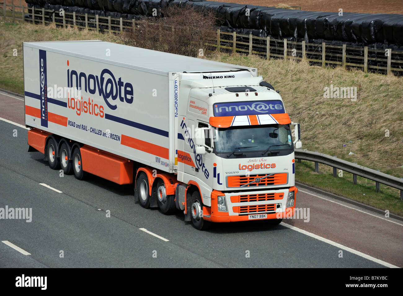 Three axle Volvo FH truck with refrigerated tri axle trailer Innovate Logistics on Motorway Stock Photo