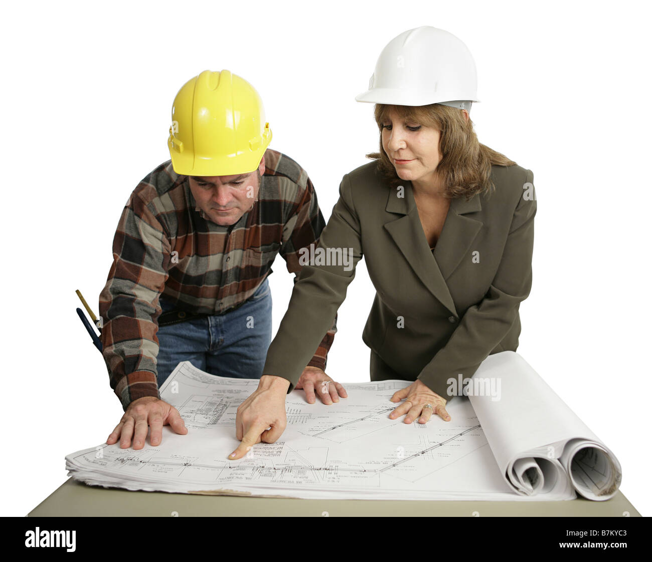 A female engineer going over the blueprints with a building contractor ...