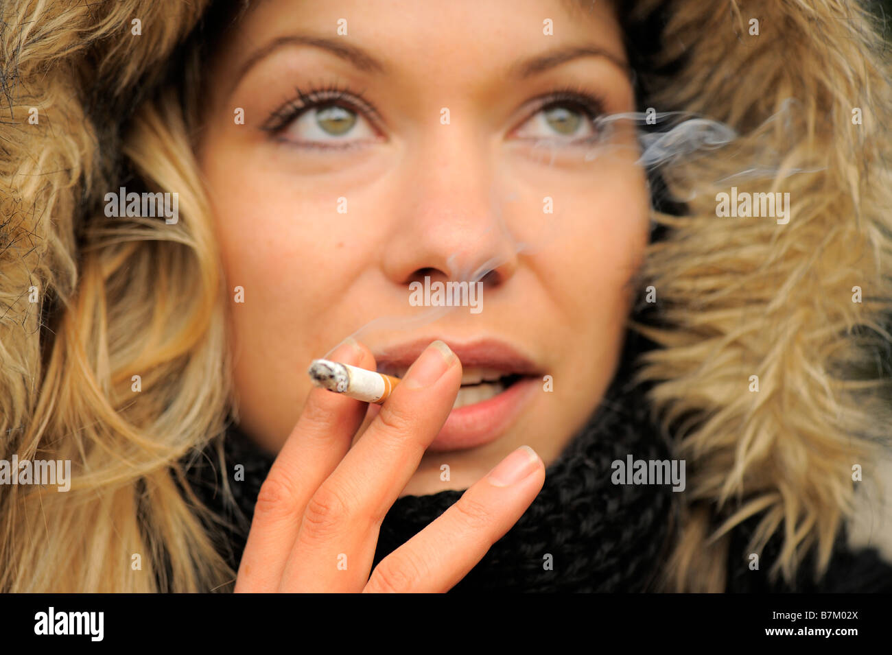 young woman smoking Stock Photo