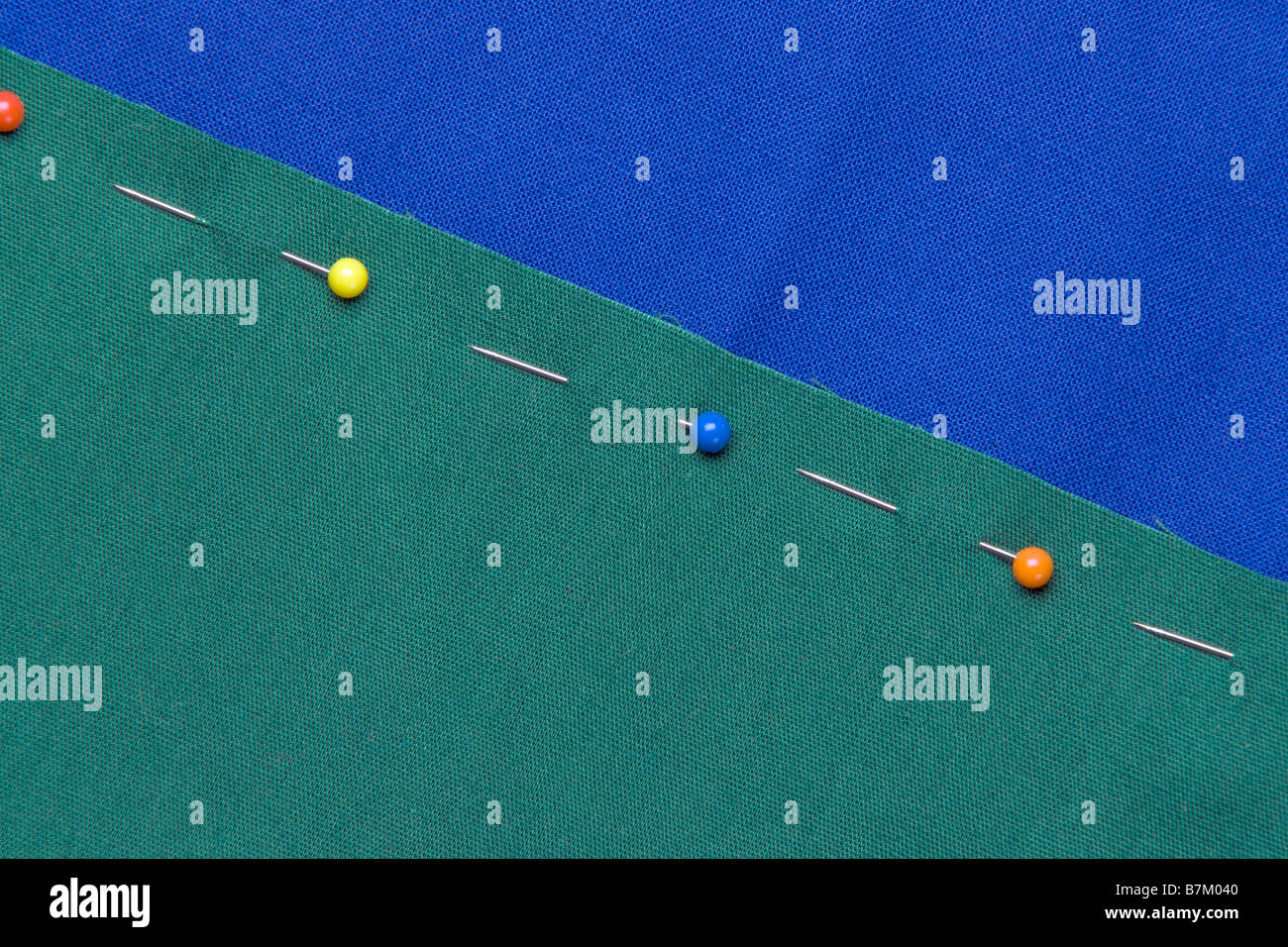 straight pins holding together fabric Stock Photo Alamy