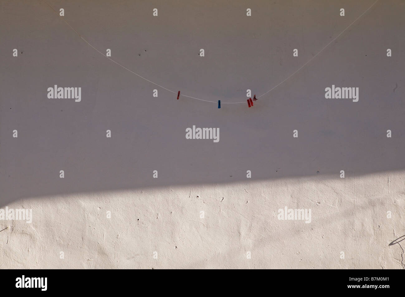 Clothes line and clothes pins Stock Photo