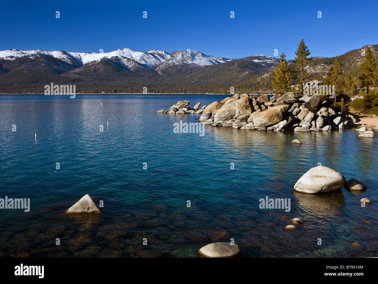 Rocks line the shore of Lake Tahoe Sand Harbor Lake Tahoe State Park Nevada Stock Photo