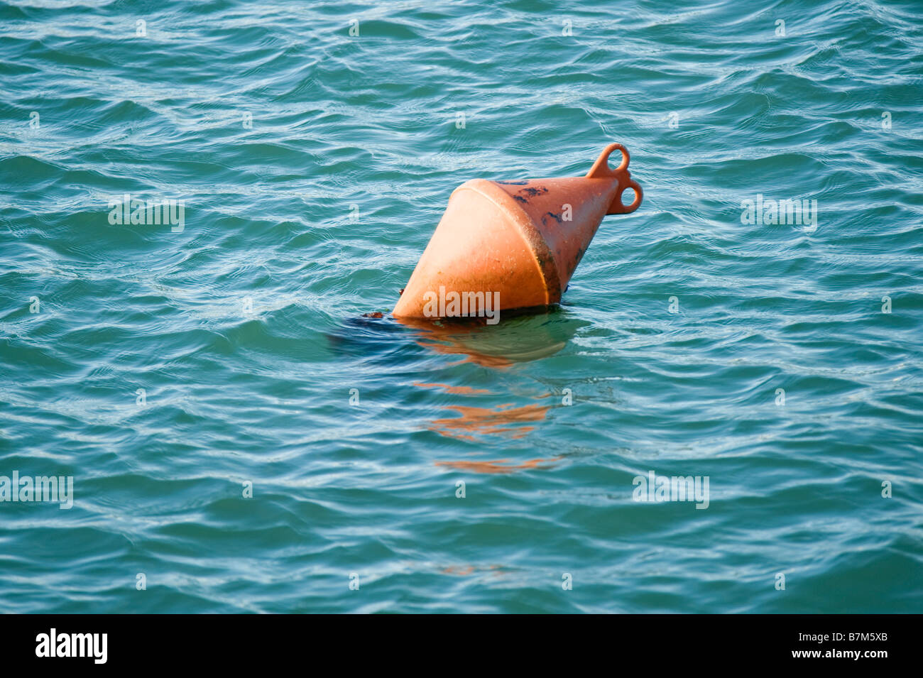 Orange buoy, France Stock Photo