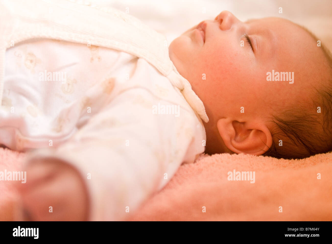 Baby sleeping safe and sound Stock Photo Alamy