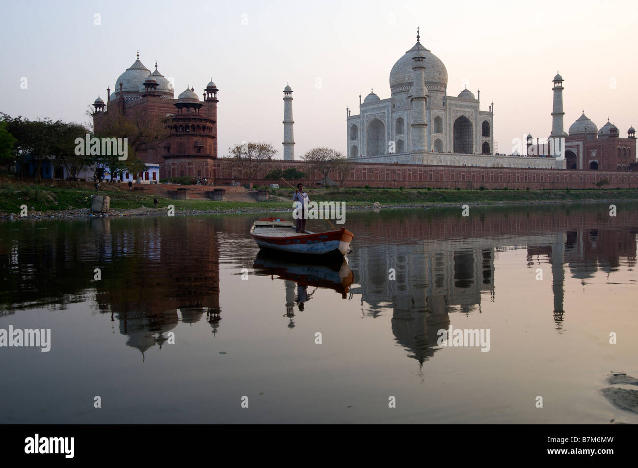 Taj Mahal reflecting in the Yamuna river at sunset Stock Photo