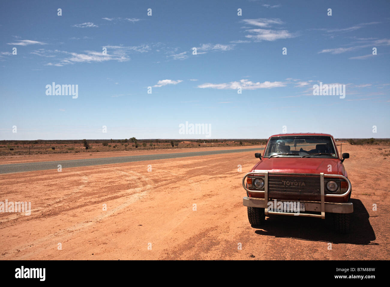 Road to Uluru, red dust, four wheel drive. Stock Photo
