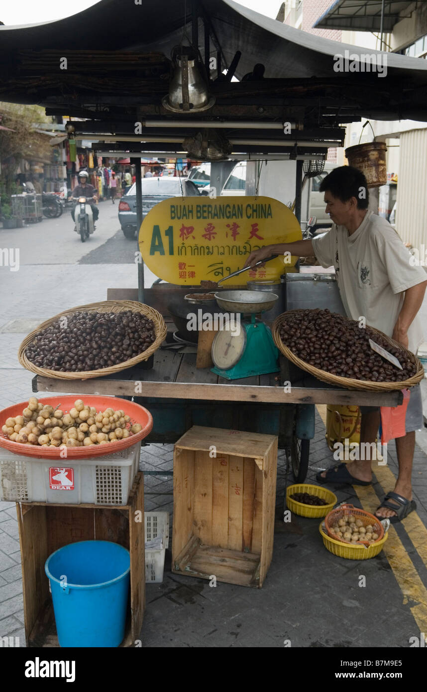 Malaysian chestnut street hawker, Penang, Malaysia Stock Photo