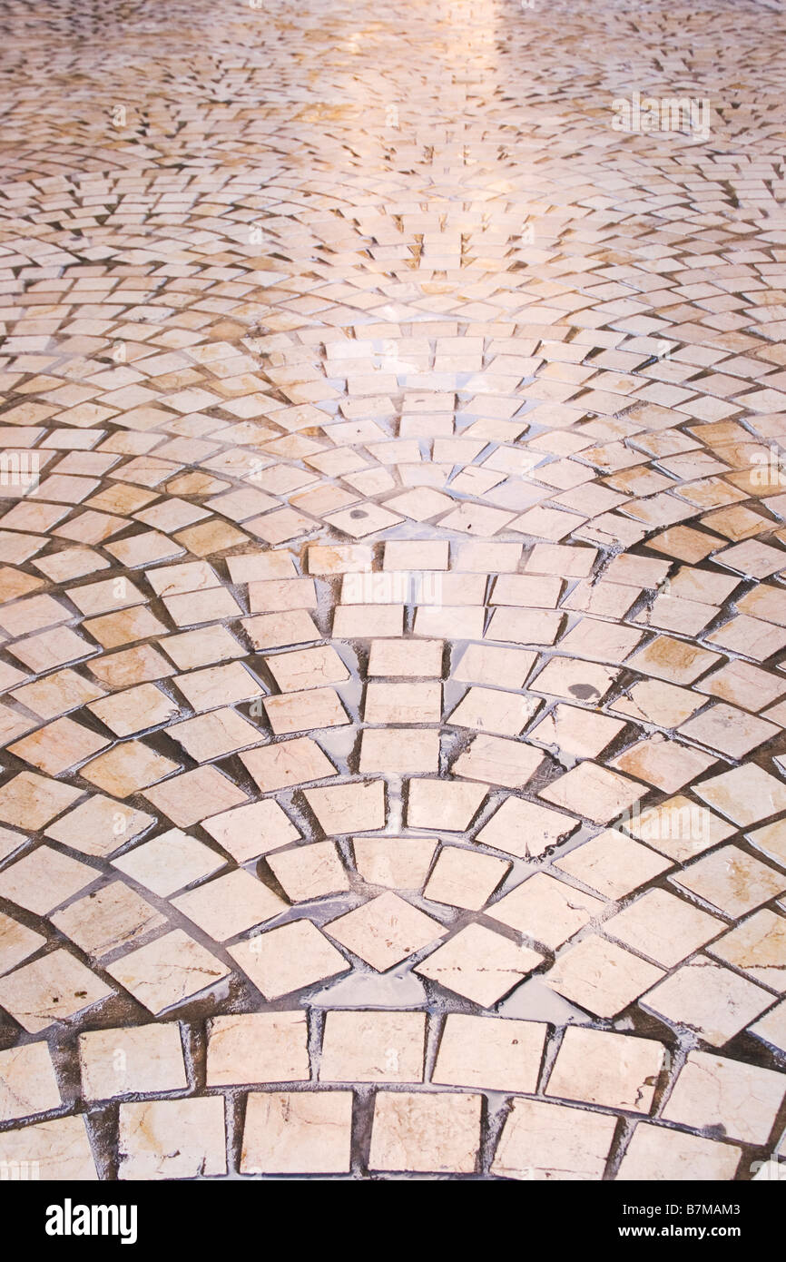 Repetetive pattern of wet paving stones Stock Photo - Alamy